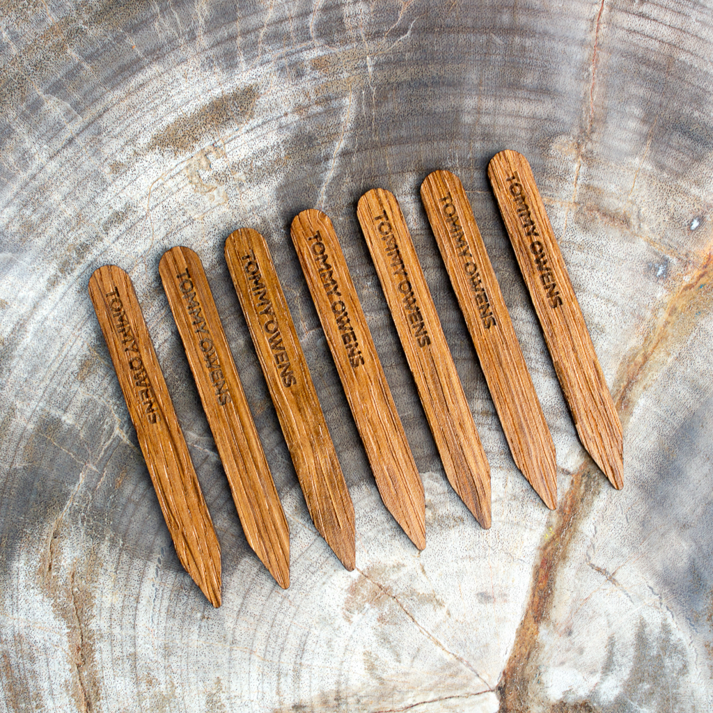 Classic oak wood collar stays lined up, showcasing their timeless grain pattern and smooth finish.