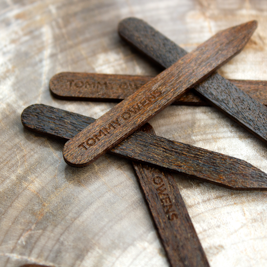 Ipe wood collar stays scattered on a work bench, showcasing their strength and resilience.