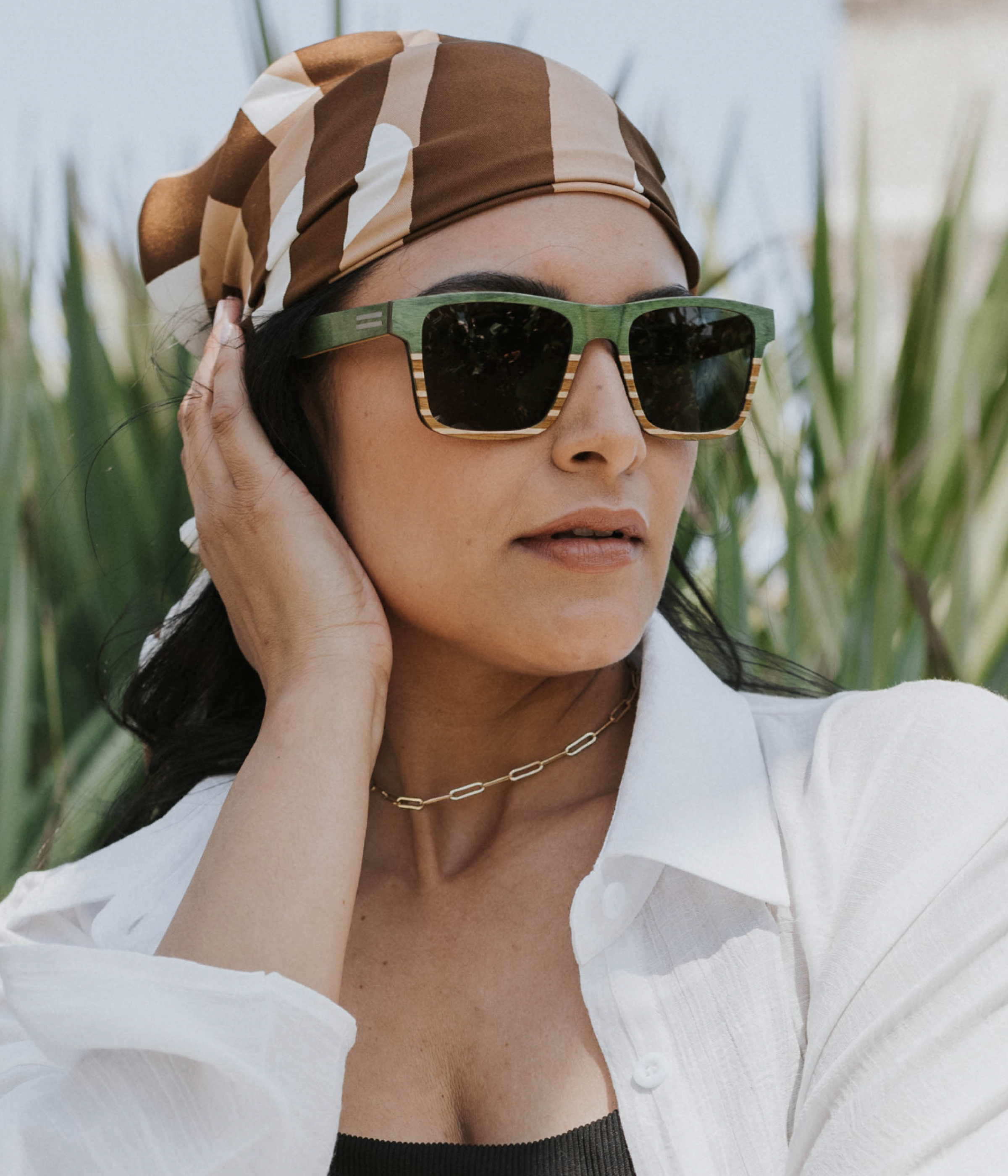 Sebastian Green Maritime Special Edition sunglasses in maple and teak wood at the Worth Avenue clock tower