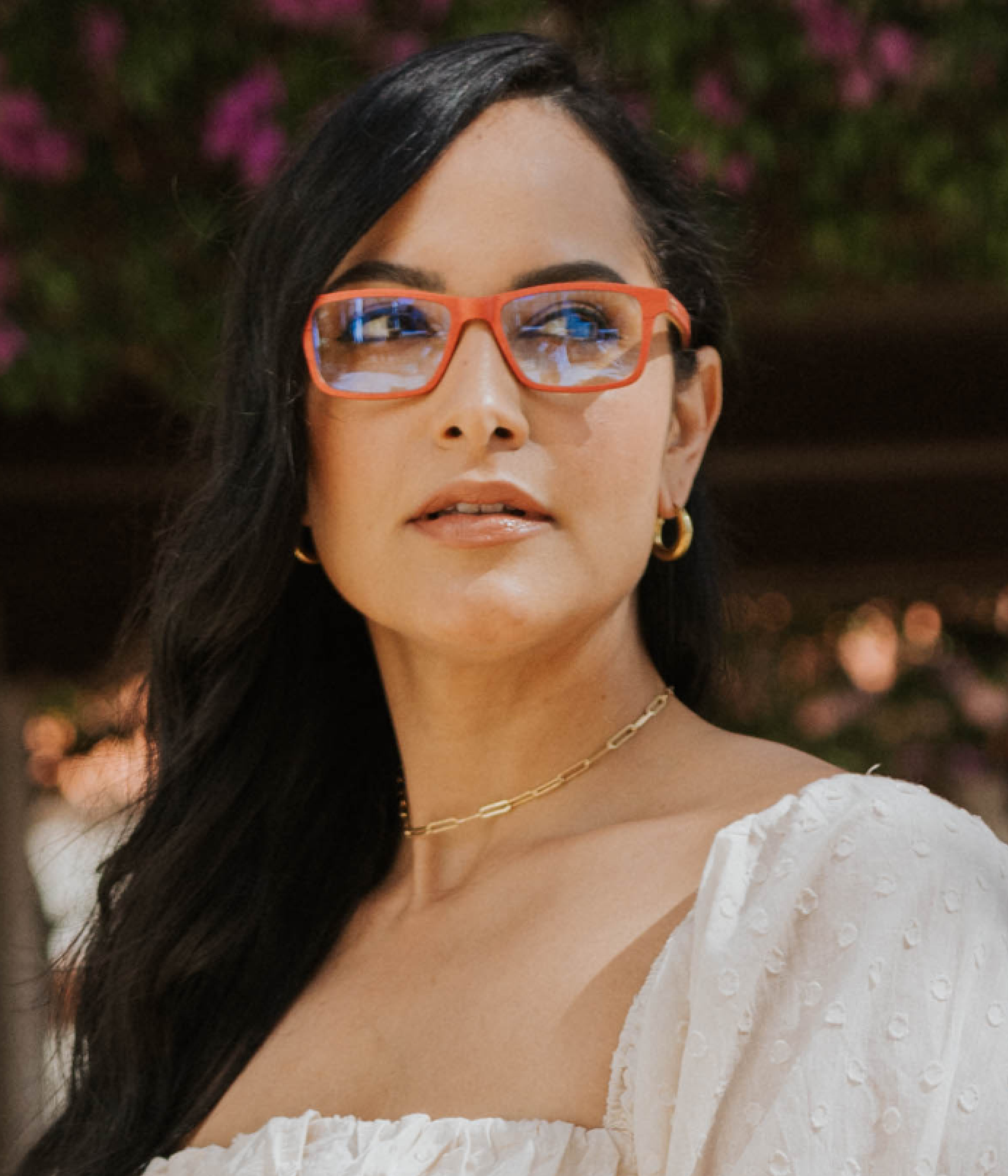 Brickell eyeglasses in red maple wood worn while walking in downtown Palm Beach near Worth Avenue