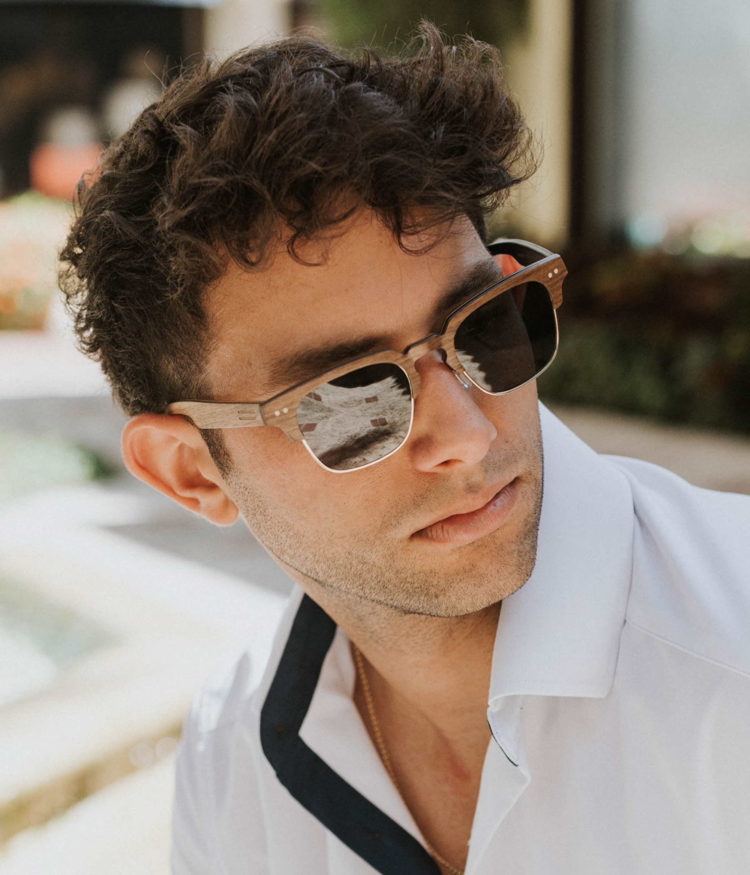 Naples sunglasses with walnut wood and carbon fiber seen downtown Palm Beach near Worth Avenue