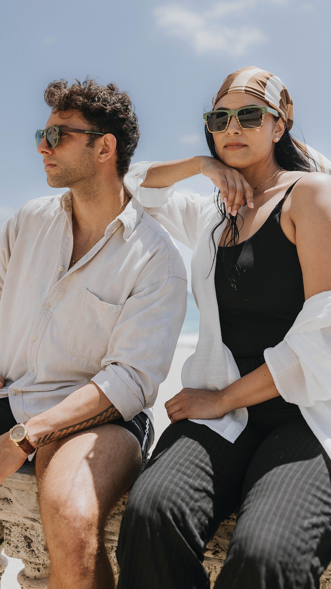 Anna Marie in balsam acrylic and walnut wood and Sebastian Green Maritime Special Edition sunglasses on the seawall in Palm Beach