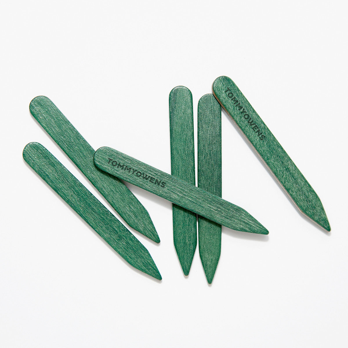 Unique forest green maple collar stays lined up, showcasing their distinctive color and smooth finish.