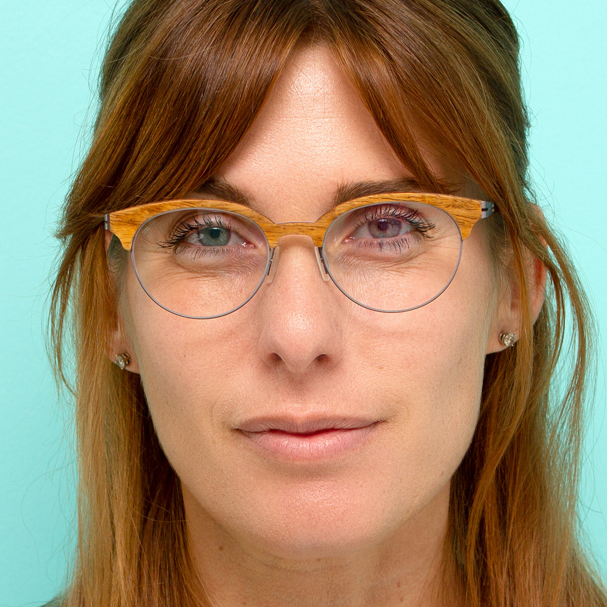 Women wearing round lightweight wood and metal eyeglasses