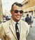 Man wearing Tommyowens mahogany wooden sunglasses at New York Fashion Week