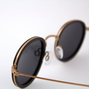 Pasco rose gold lightweight titanium & ebony rimmed wood sunglasses up close